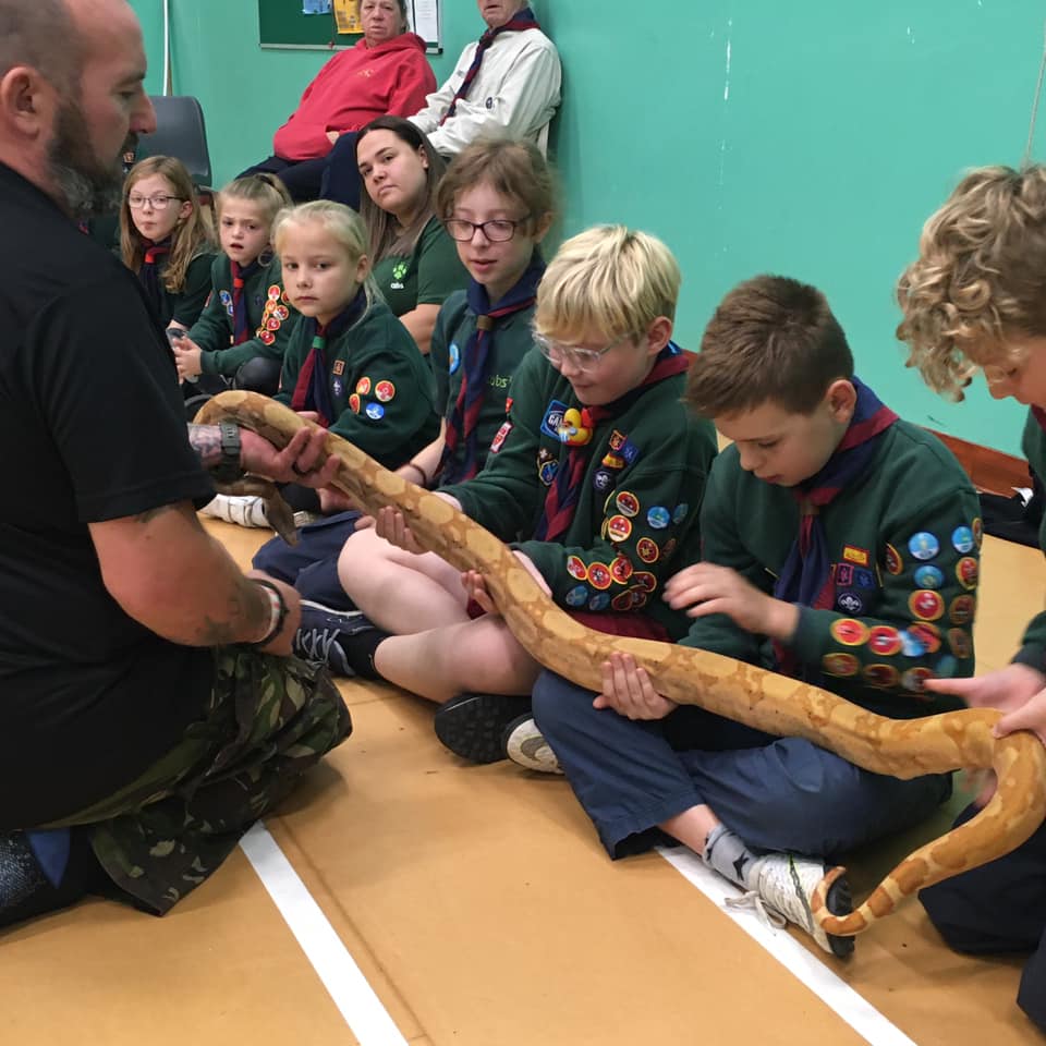 24th Hastings Cubs holding a snake